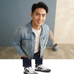 Mark Tan wearing casual denim and Anjrs sports shoes in a professional headshot against a clean studio background.