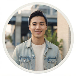 A portrait of Chris Vu wearing casual clothing and Anjrs running shoes against a clean, neutral urban backdrop.
